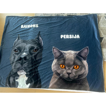 A cozy blanket featuring a detailed illustration of a black and white dog named "Bairons" on the left and a gray cat with striking orange eyes named "Persija" on the right, both set against a dark blue background.