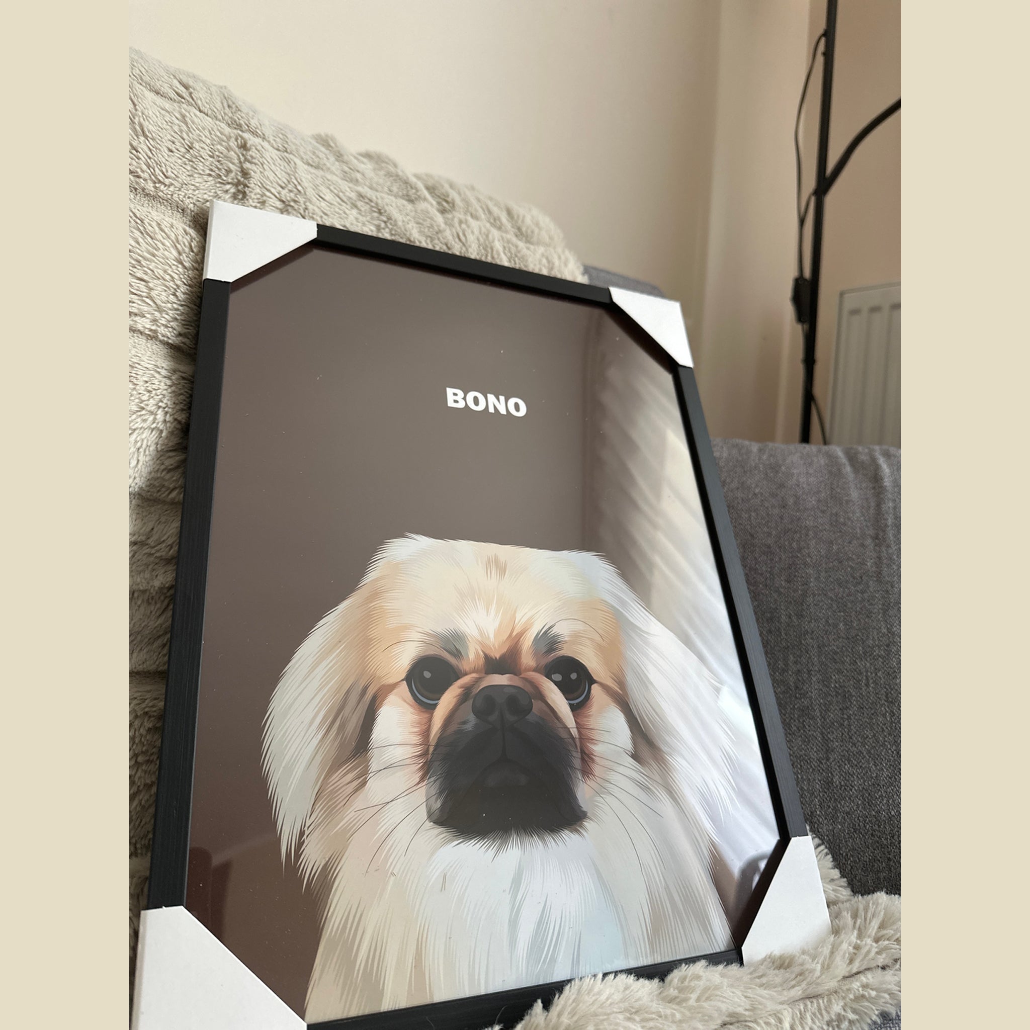 Close-up photo of a custom pet portrait framed poster featuring artwork of a white dog