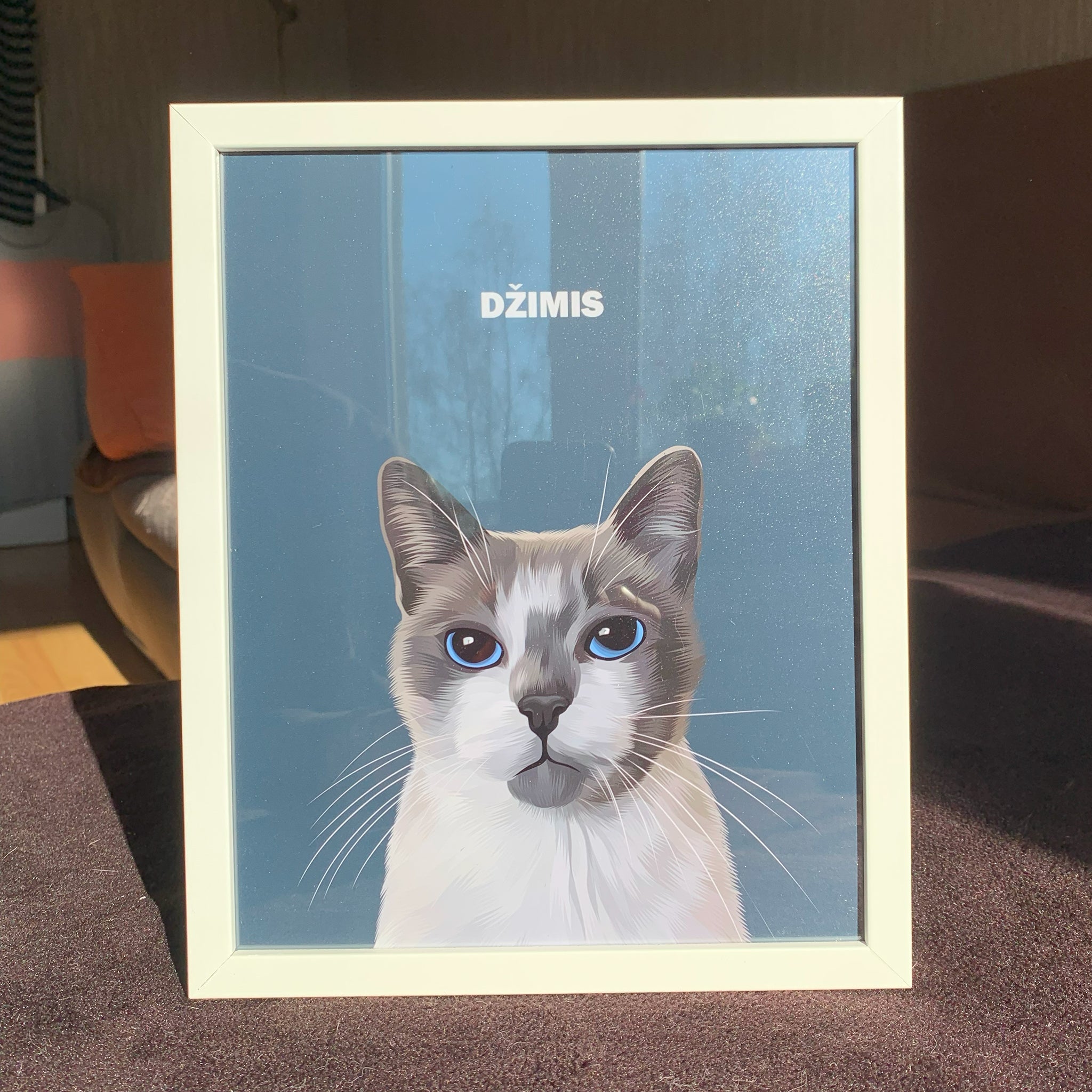 Close up photo of custom pet portrait framed poster with white and grey cat's artwork on it