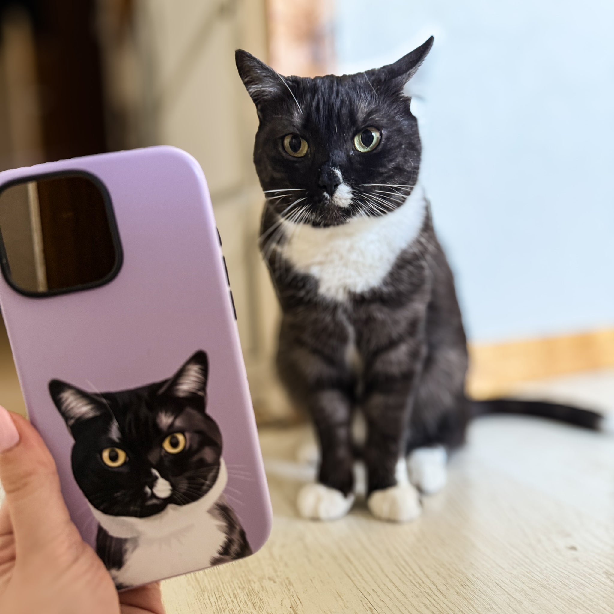 Photo of custom pet portrait tough phone case featuring blak-white cat