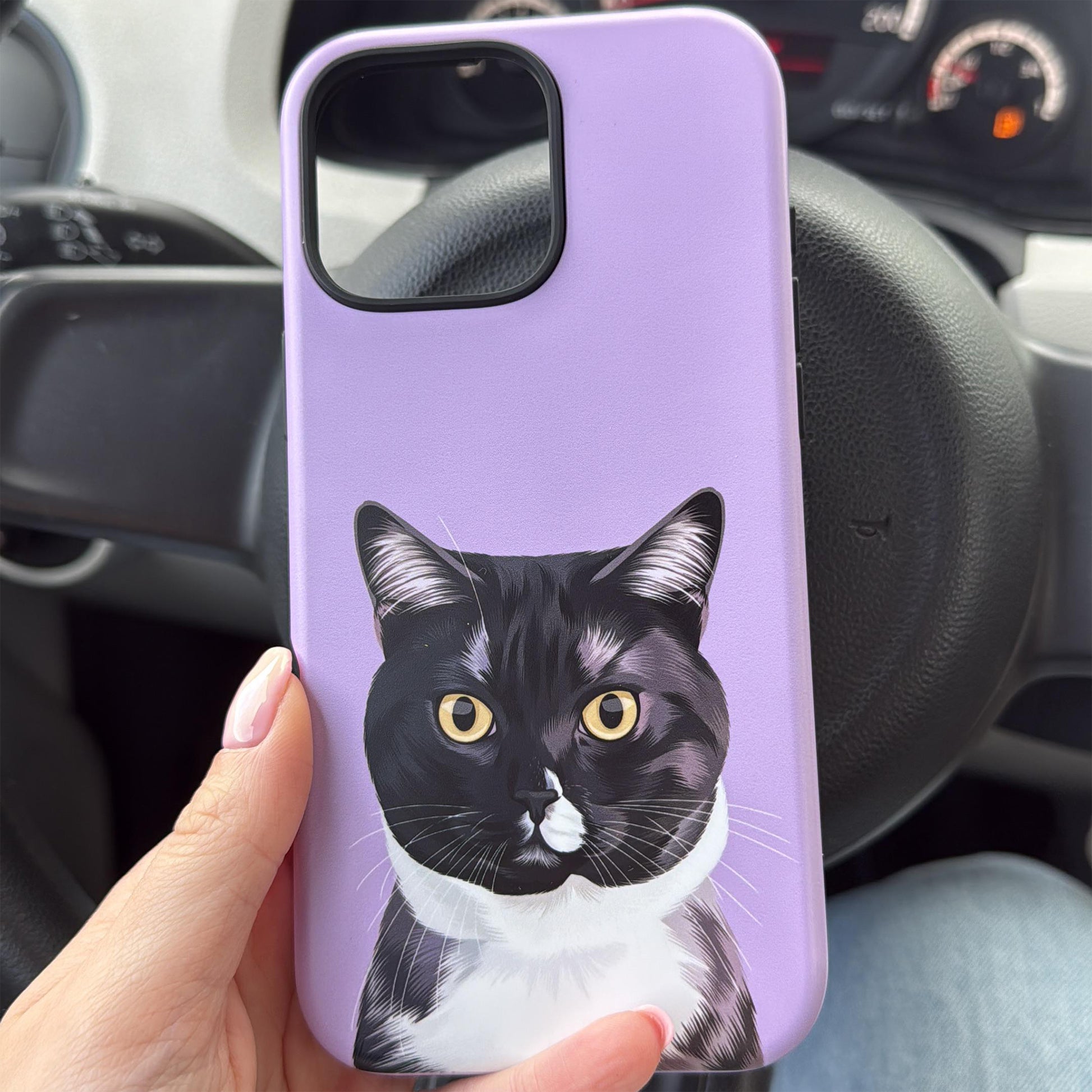 Close up photo of custom pet portrait tough phone case in purple color with black and white cat on the case.